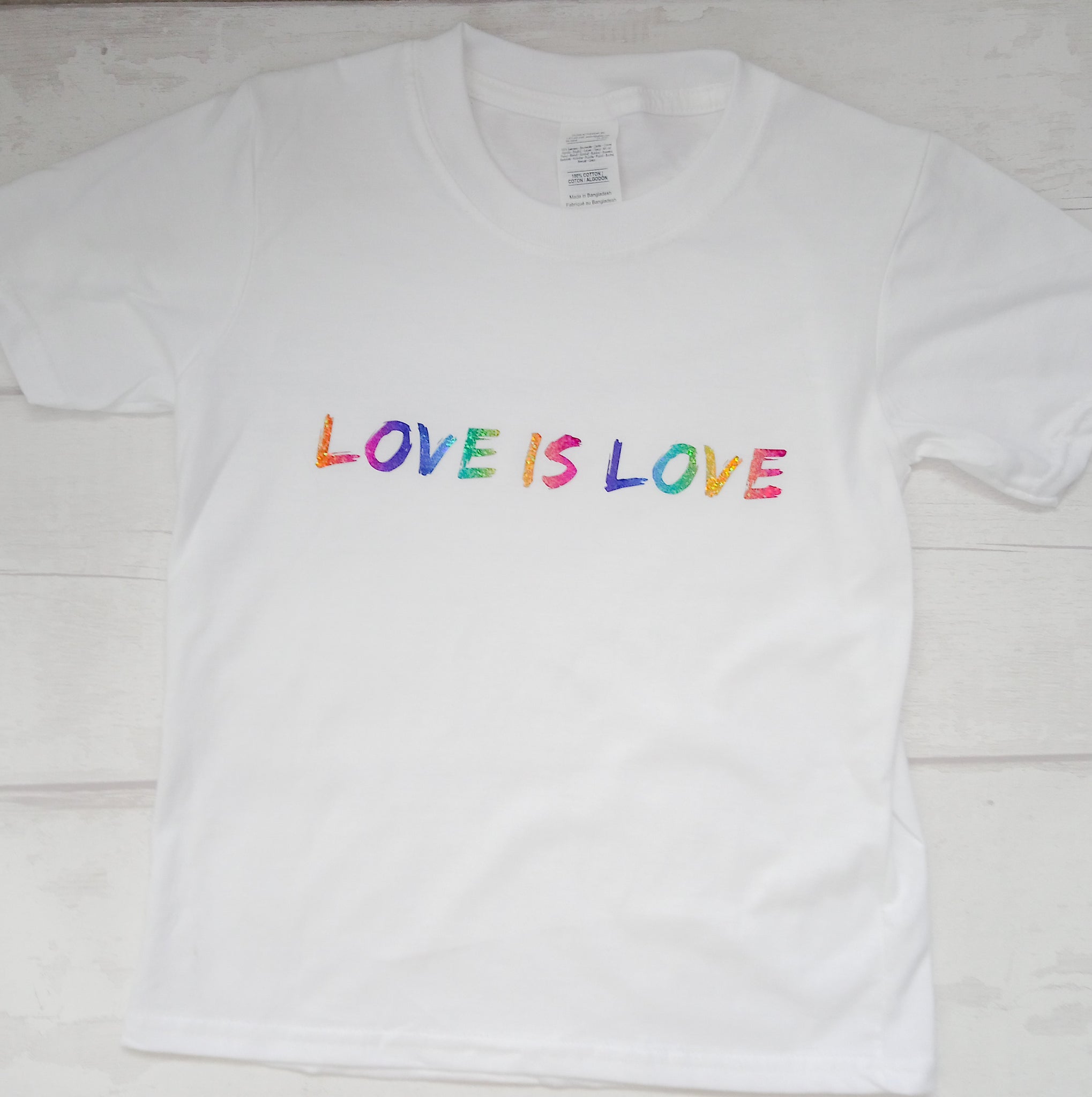Gorgeous rainbow vinyl "love is love" unisex adults t shirt